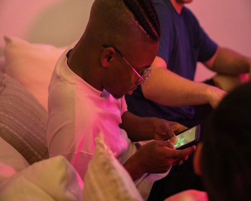 Mobile gaming demonstration shown on a smartphone screen during a technology showcase